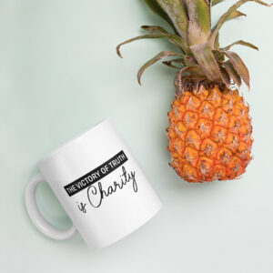 the victory of truth is charity white glossy mug